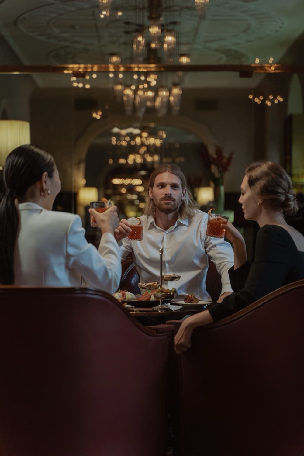 Guests dining in a warm, low-lit dining room